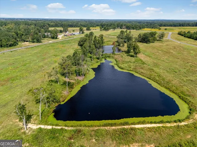 a view of a lake with a yard