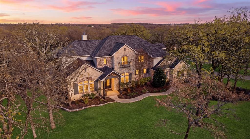 9651 Yellow Rose Lane Pilot Point, TX 76258 - Photo 2 of 38 an aerial view of a house with a yard