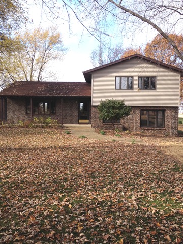 463 Reuter Road Amboy, IL 61310 - Photo 1 of 11 a front view of a house with yard