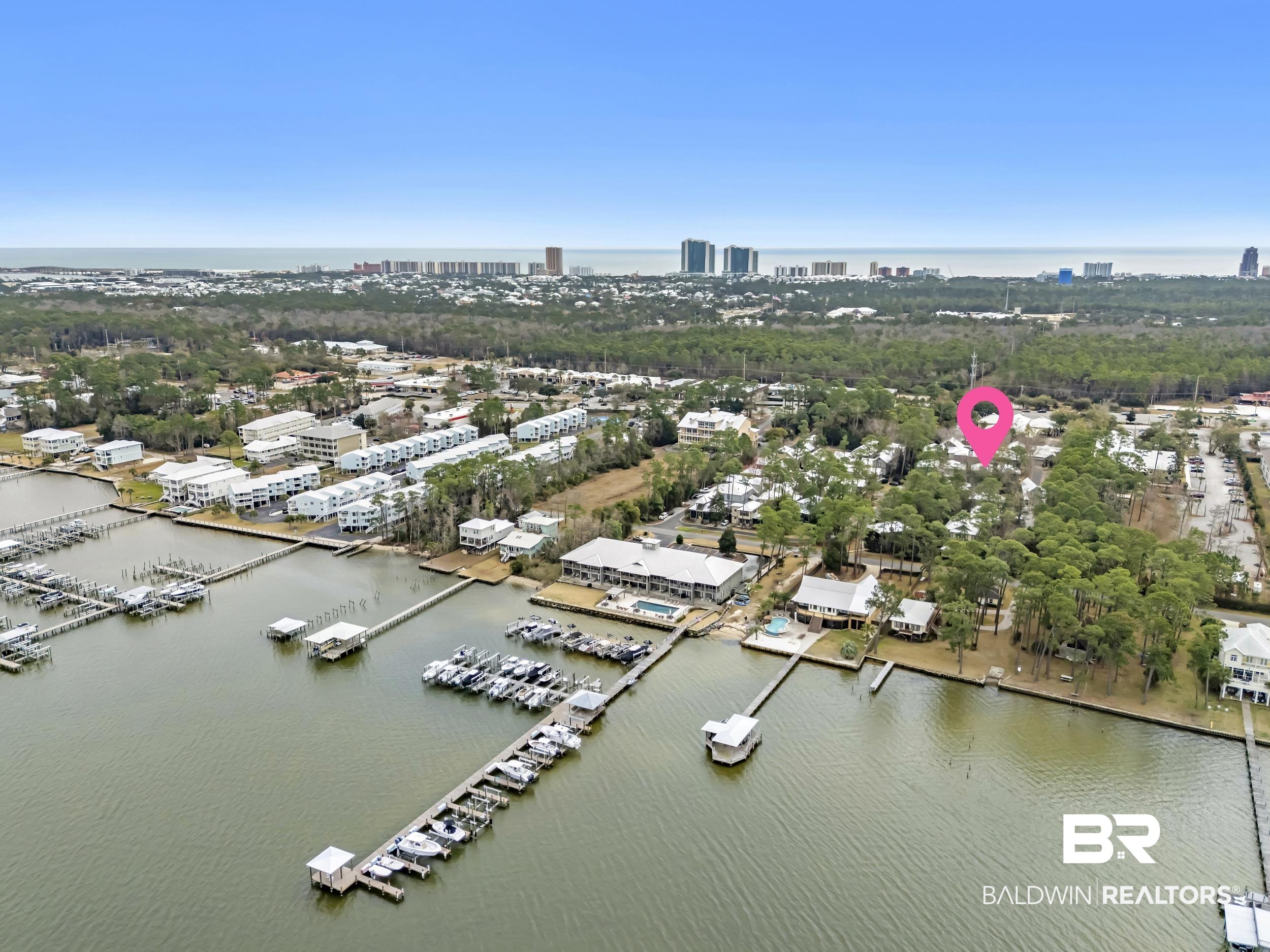 25773 Canal Road, Unit 32 Orange Beach, AL 36561 - Photo 31 of 35 View of urban area with a large body of water and numerous boat docks