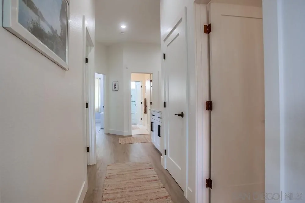 2322 Byron Place Carlsbad, CA 92008 - Photo 19 of 56 a bathroom with a glass shower door