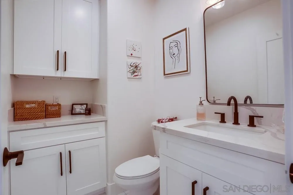 2322 Byron Place Carlsbad, CA 92008 - Photo 20 of 56 a bathroom with a sink toilet and vanity