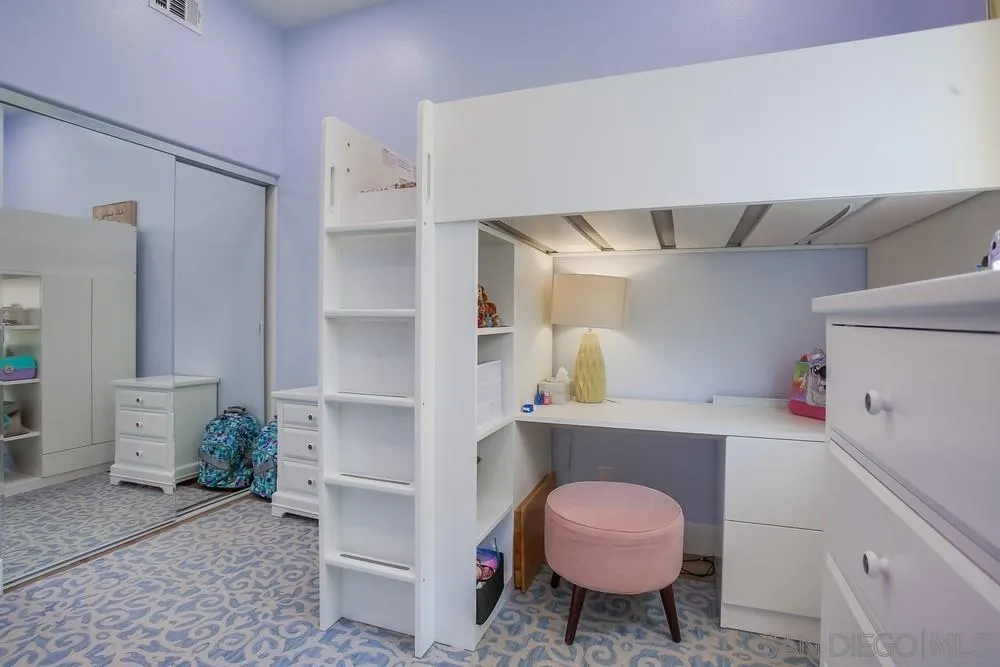 2322 Byron Place Carlsbad, CA 92008 - Photo 27 of 56 a room with a cabinets and chair