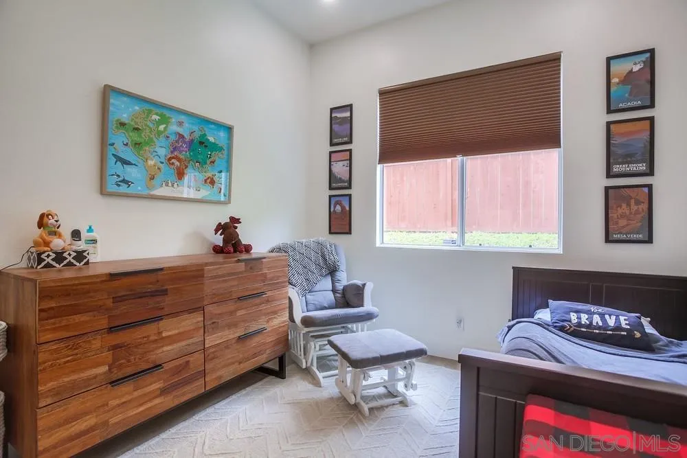 2322 Byron Place Carlsbad, CA 92008 - Photo 31 of 56 a bed room with a bed and a chair