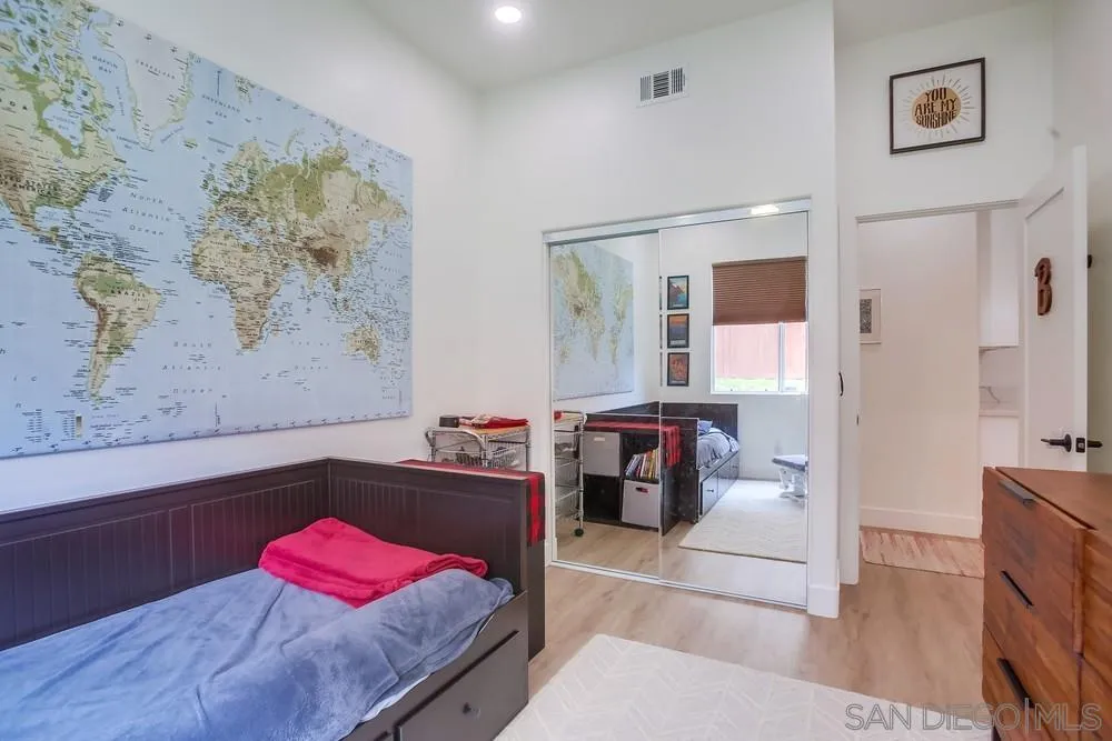 2322 Byron Place Carlsbad, CA 92008 - Photo 32 of 56 a bedroom with a bed and a couch