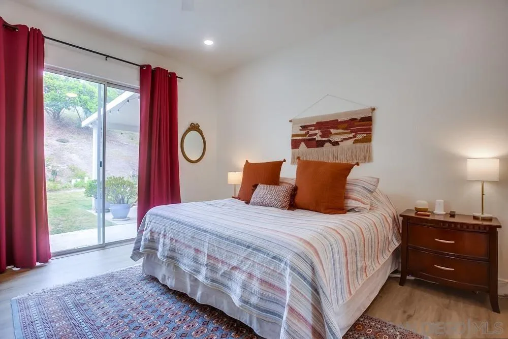 2322 Byron Place Carlsbad, CA 92008 - Photo 33 of 56 a bedroom with a large bed and a window