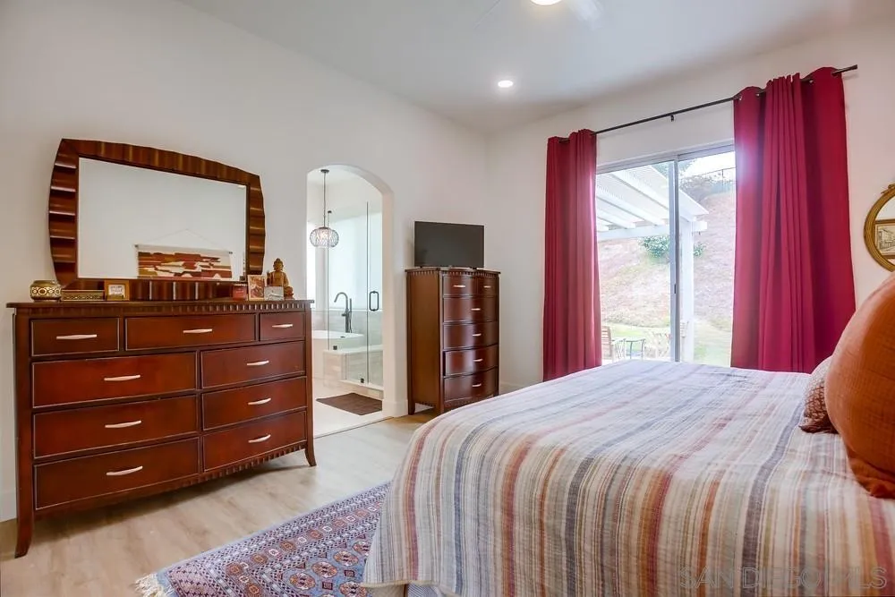 2322 Byron Place Carlsbad, CA 92008 - Photo 34 of 56 a bedroom with a bed and a dresser