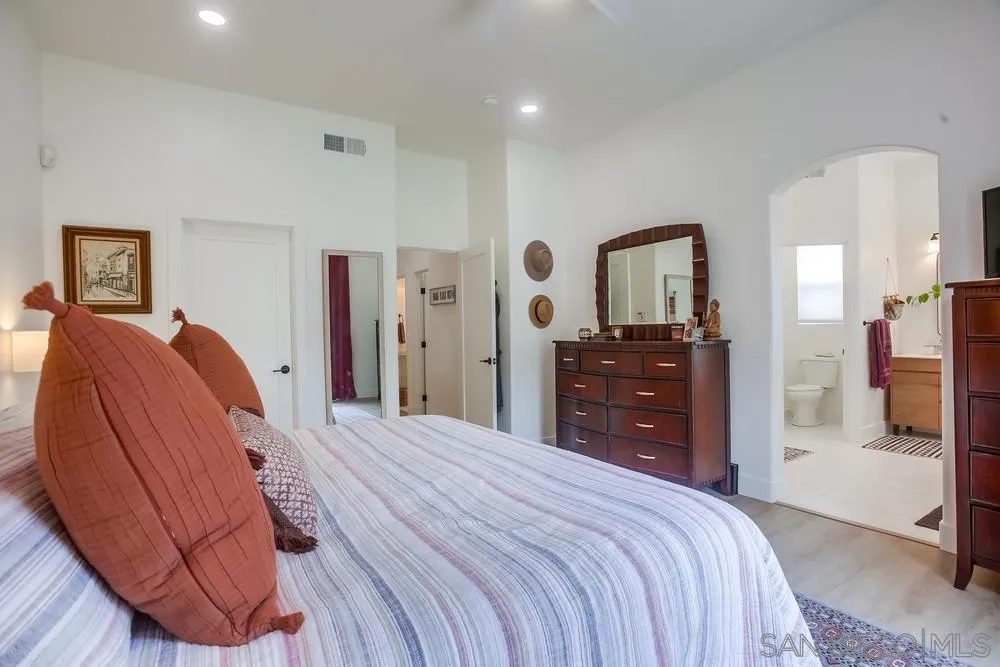 2322 Byron Place Carlsbad, CA 92008 - Photo 35 of 56 a bedroom with a bed and a dresser