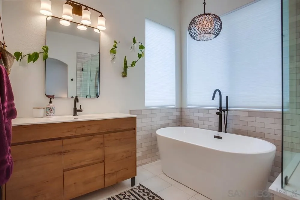 2322 Byron Place Carlsbad, CA 92008 - Photo 38 of 56 a bathroom with a sink and a mirror