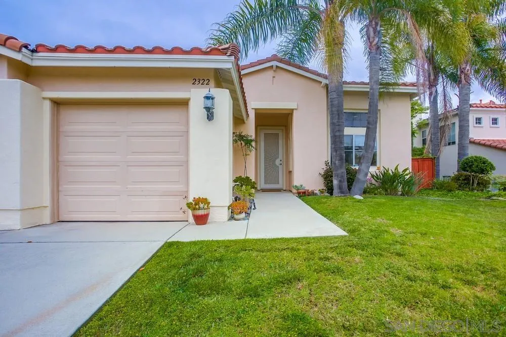 2322 Byron Place Carlsbad, CA 92008 - Photo 4 of 56 a front view of a house with a yard