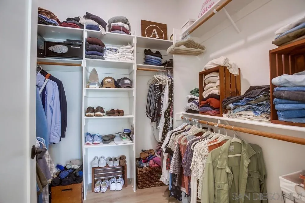2322 Byron Place Carlsbad, CA 92008 - Photo 41 of 56 a view of walk in closet with clothes and shoes
