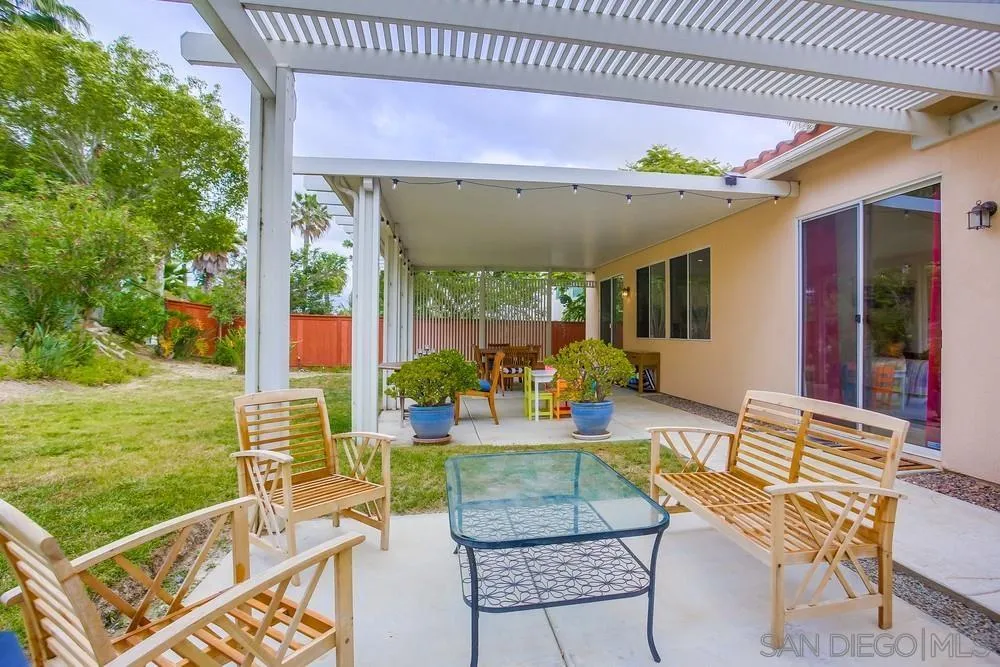 2322 Byron Place Carlsbad, CA 92008 - Photo 48 of 56 a patio with garden area and outdoor seating
