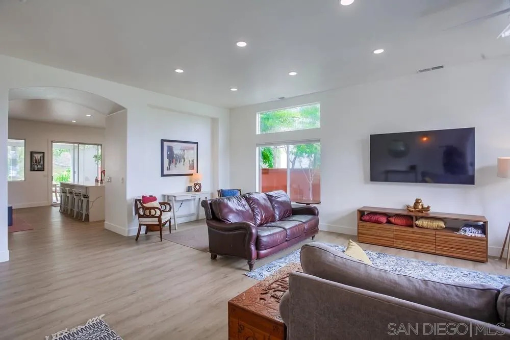 2322 Byron Place Carlsbad, CA 92008 - Photo 5 of 56 a living room with furniture and a flat screen tv
