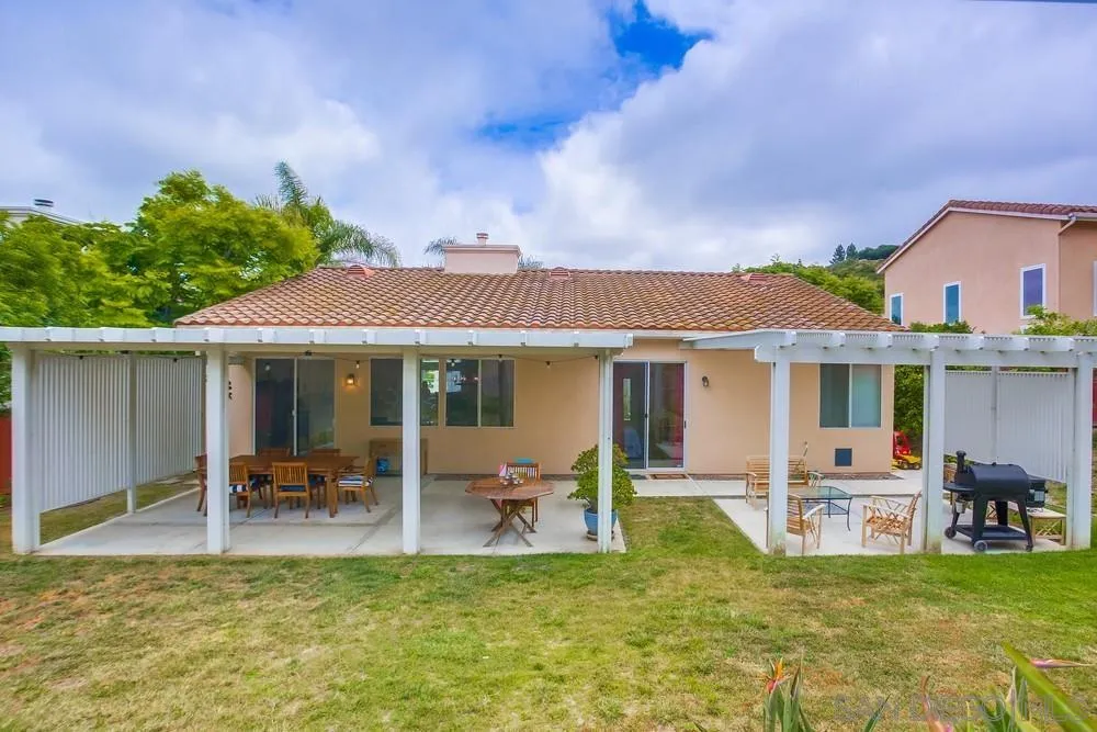 2322 Byron Place Carlsbad, CA 92008 - Photo 52 of 56 a view of a patio with table and chairs potted plants and large tree