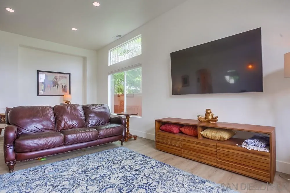 2322 Byron Place Carlsbad, CA 92008 - Photo 8 of 56 a living room with furniture and a flat screen tv