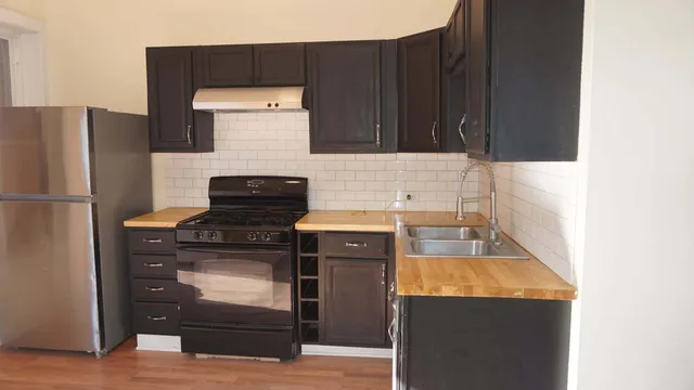 a kitchen with a stove and a refrigerator