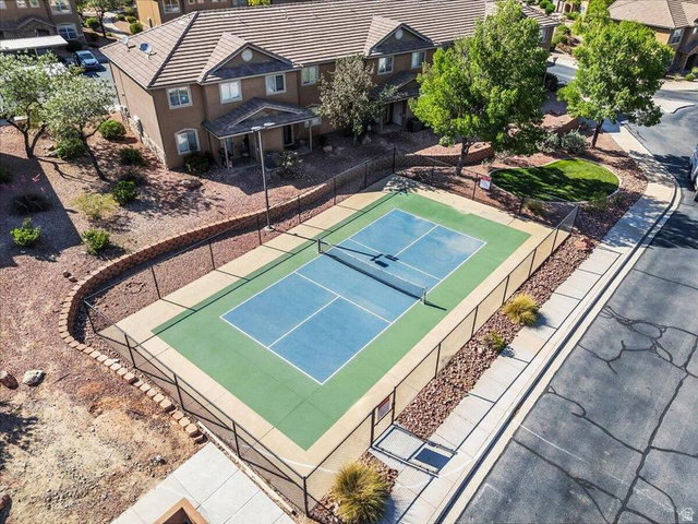 3155 South Hidden Dr Street, Unit 248 St. George, UT 84790 - Photo 21 of 24 Fenced tennis court with blue and green surfacing