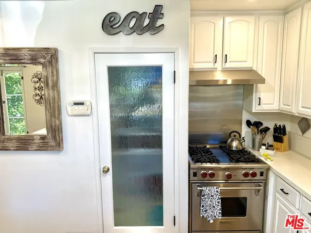 a utility room with sink dryer and washer