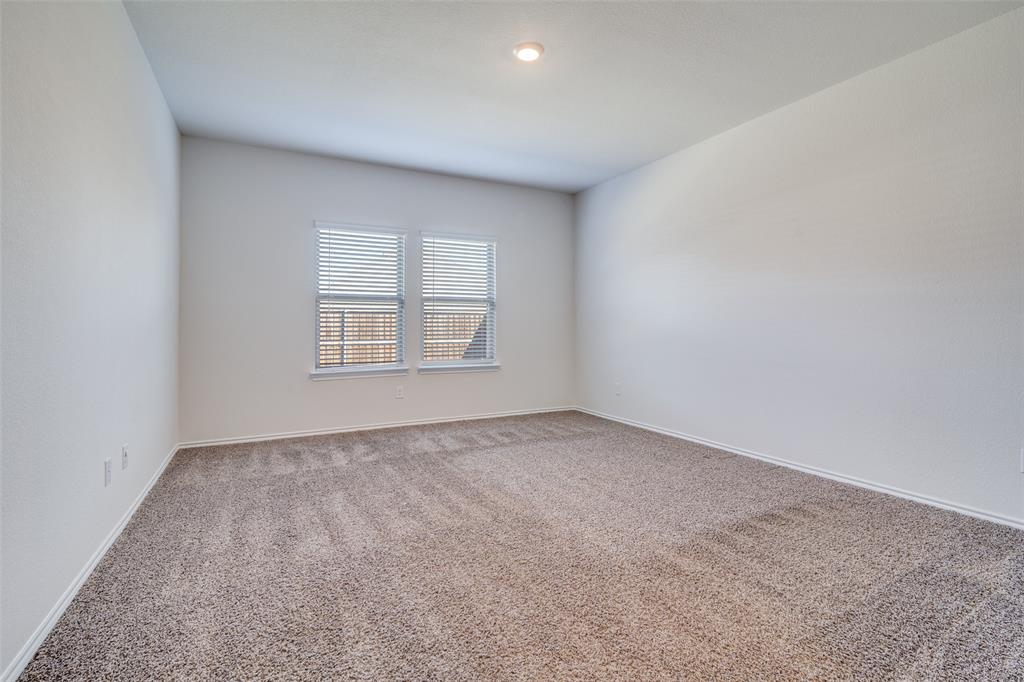 3025 Frazier Street Forney, TX 75126 - Photo 11 of 25 an empty room with windows