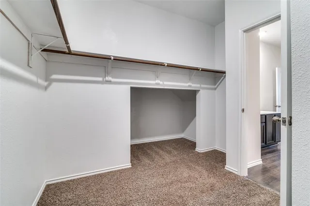 a view of an empty walk in closet