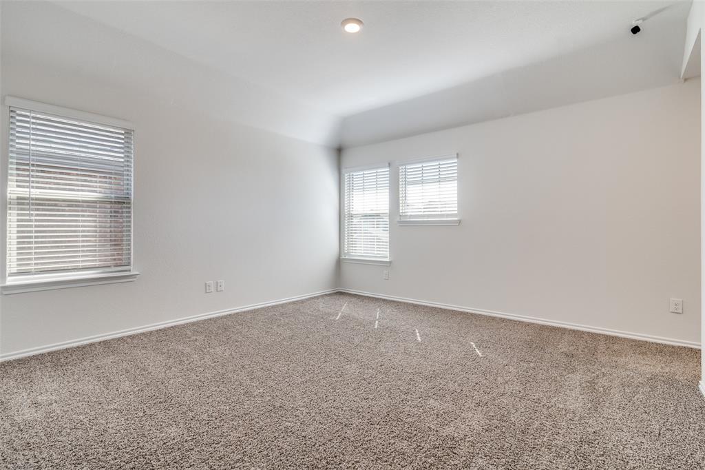 3025 Frazier Street Forney, TX 75126 - Photo 17 of 25 an empty room with windows