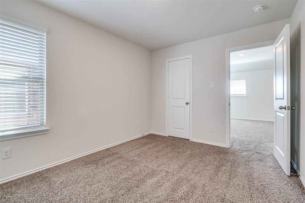 3025 Frazier Street Forney, TX 75126 - Photo 20 of 25 an empty room with windows and closet