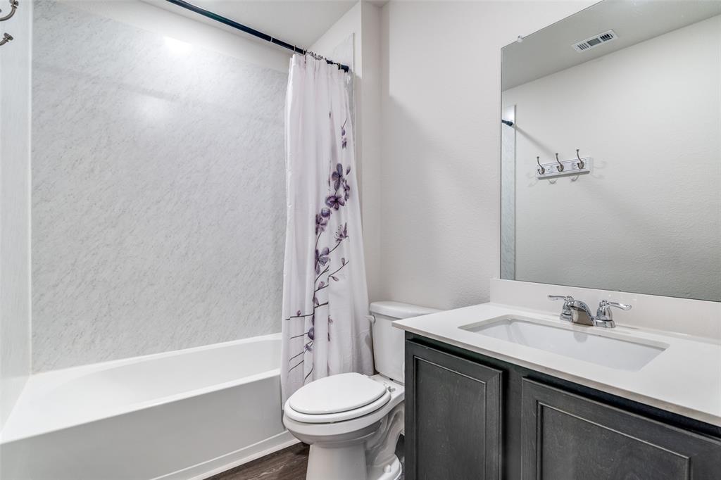 3025 Frazier Street Forney, TX 75126 - Photo 22 of 25 a bathroom with a sink toilet and shower