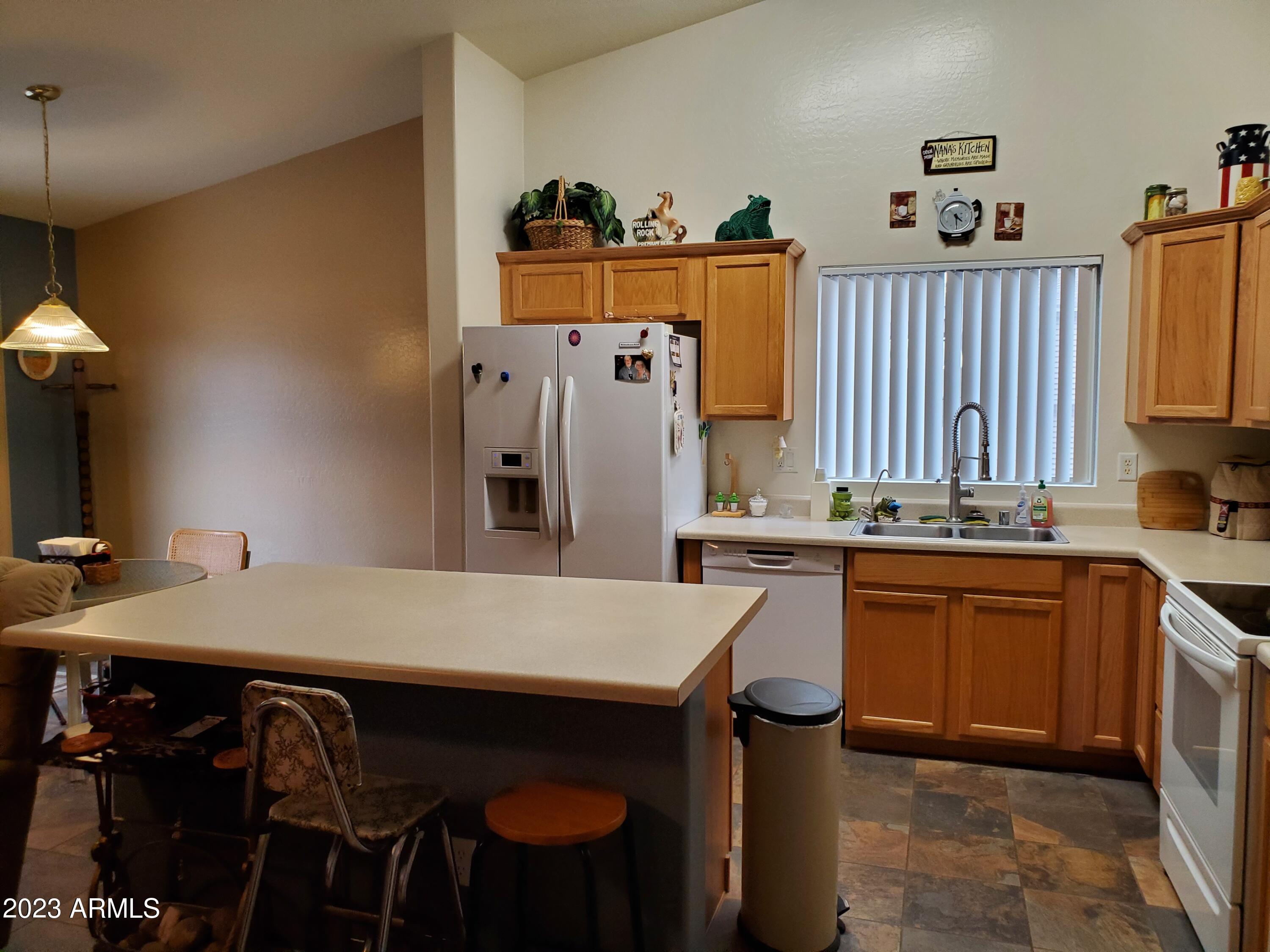 12753 West Calavar Road El Mirage, AZ 85335 - Photo 7 of 27 Kitchen with Breakfast Bar