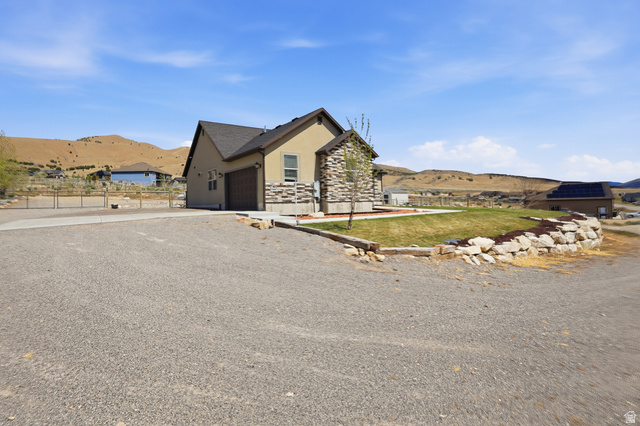1588 West Rim Rock Drive Stockton, UT 84071 - Photo 52 of 61 Contemporary residence with stucco and stone veneer exterior