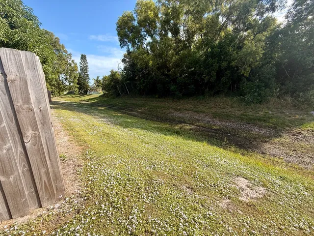 a view of a backyard of the house