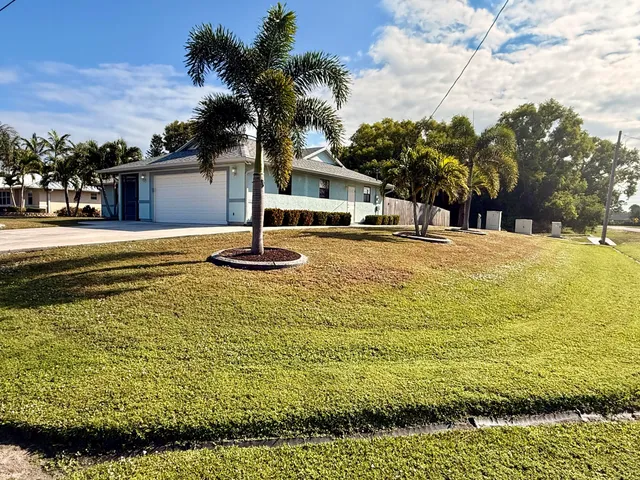 a swimming pool with trees in front of it