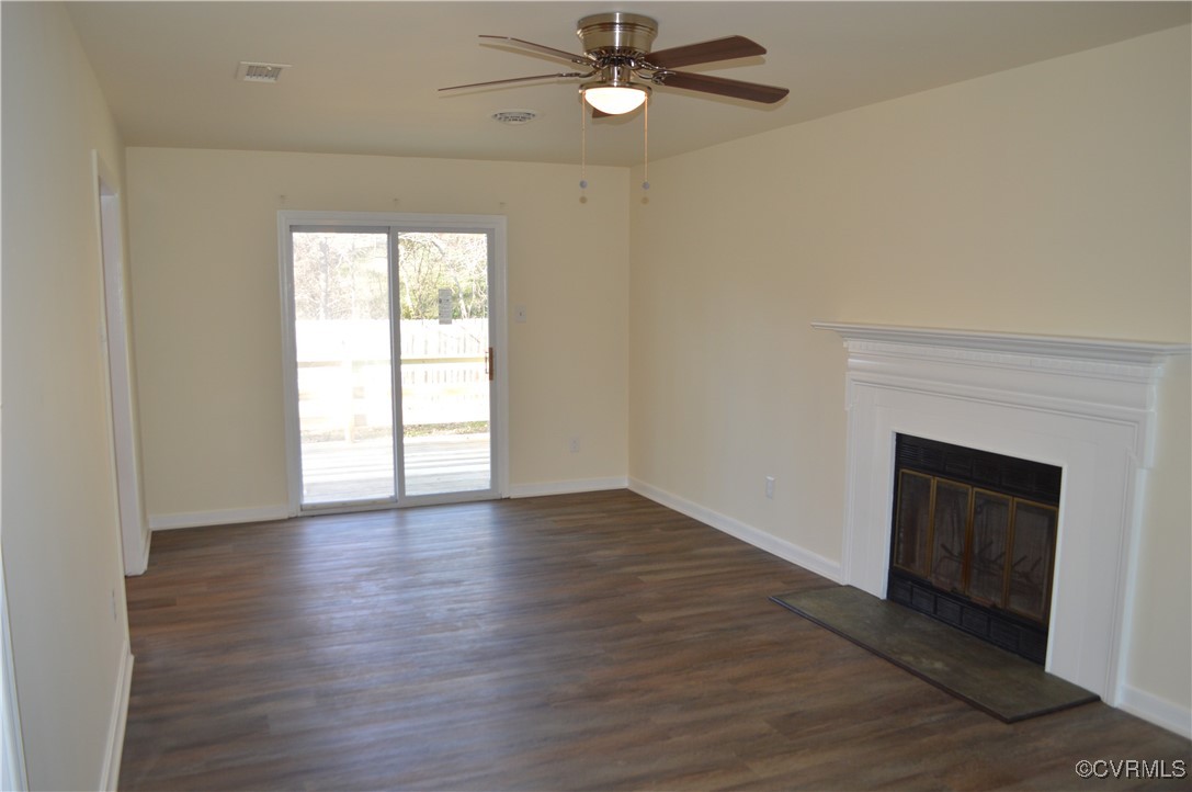 806 Marbleridge Road Chesterfield, VA 23236 - Photo 3 of 25 an empty room with wooden floor fireplace and windows
