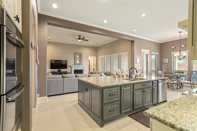 a kitchen with counter top space sink and stainless steel appliances
