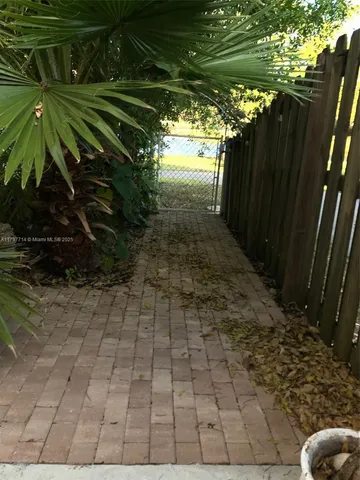 a view of outdoor space with garden and trees