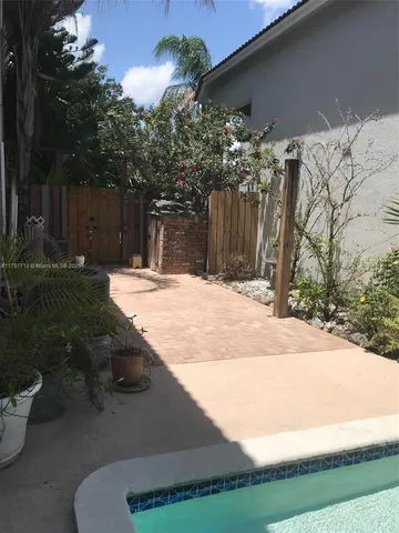 a wooden bench sitting in front of a building