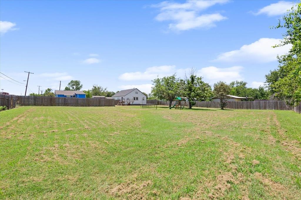 102 Brookshire Street Riesel, TX 76682 - Photo 22 of 24 a view of yard with swimming pool and green space