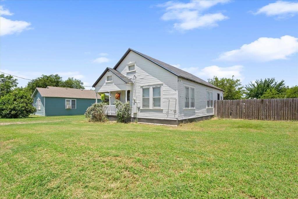 102 Brookshire Street Riesel, TX 76682 - Photo 3 of 24 a view of a house with a big yard plants and large trees