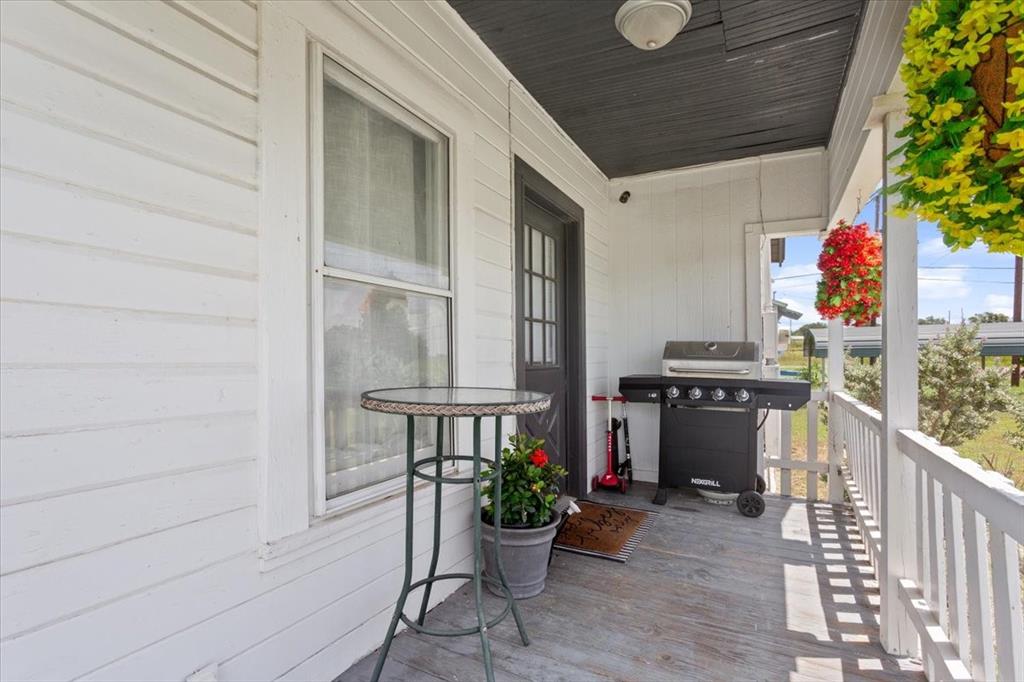 102 Brookshire Street Riesel, TX 76682 - Photo 4 of 24 a view of a patio with table and chairs and potted plants