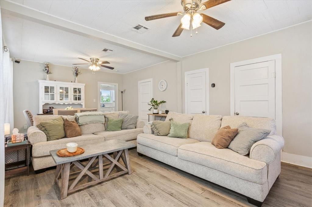 102 Brookshire Street Riesel, TX 76682 - Photo 8 of 24 a living room with furniture and a chandelier