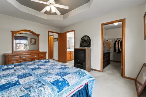 a bedroom with a bed and a dresser in it