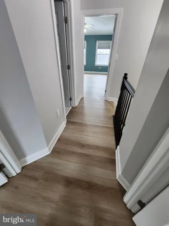 a view of a hallway view with staircase