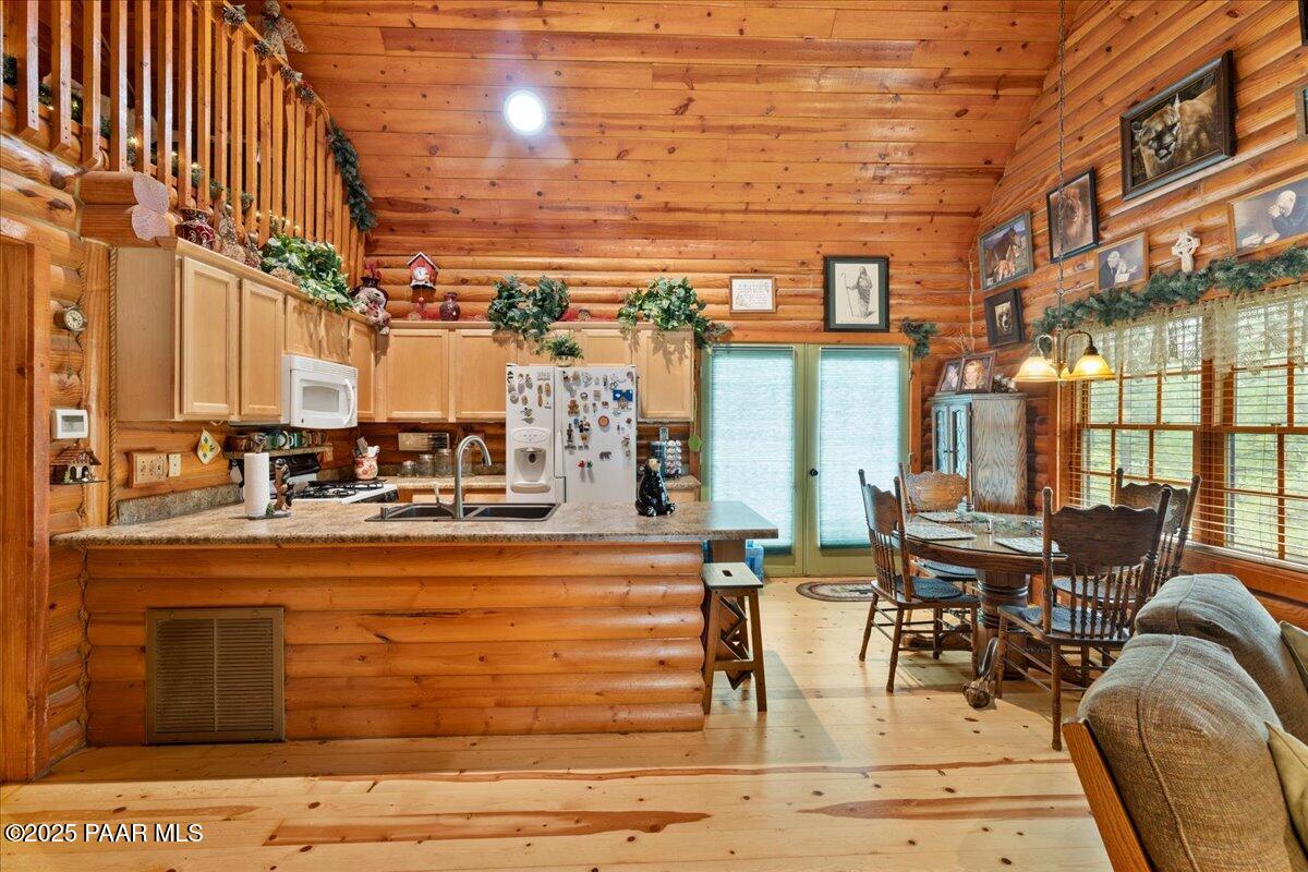 1370 East Pine Ridge Drive Prescott, AZ 86303 - Photo 11 of 32 a view of a swimming pool with outdoor seating