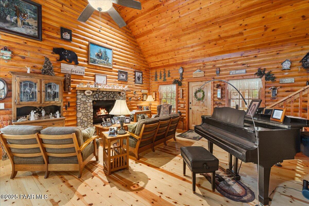 1370 East Pine Ridge Drive Prescott, AZ 86303 - Photo 13 of 32 a view of a patio with couches table and chairs with wooden floor