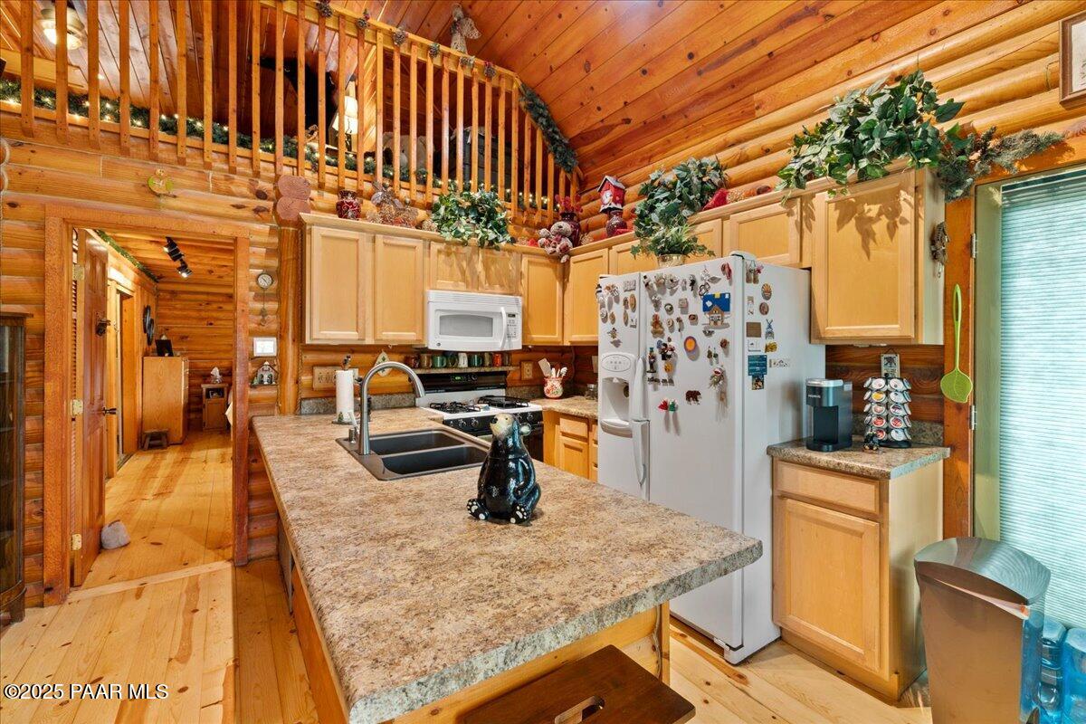 1370 East Pine Ridge Drive Prescott, AZ 86303 - Photo 15 of 32 a kitchen with stainless steel appliances granite countertop a sink a stove and refrigerator