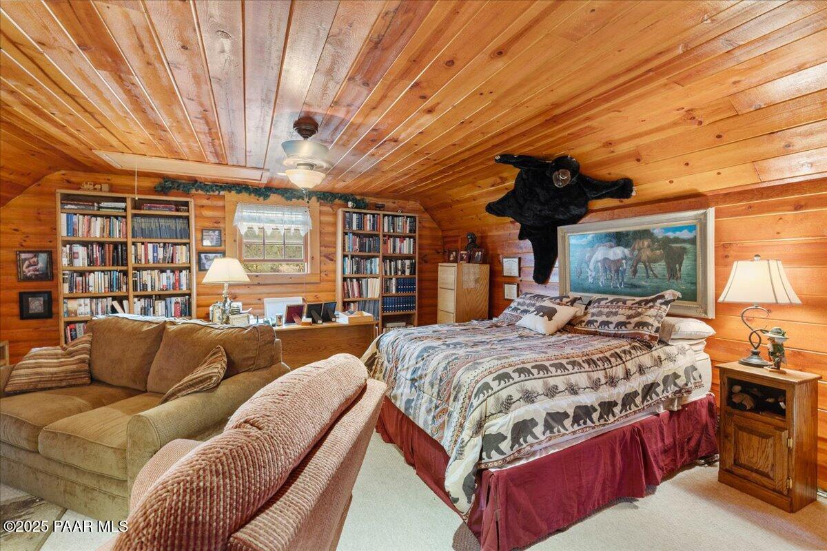 1370 East Pine Ridge Drive Prescott, AZ 86303 - Photo 24 of 32 a bed room with a bed and a couch