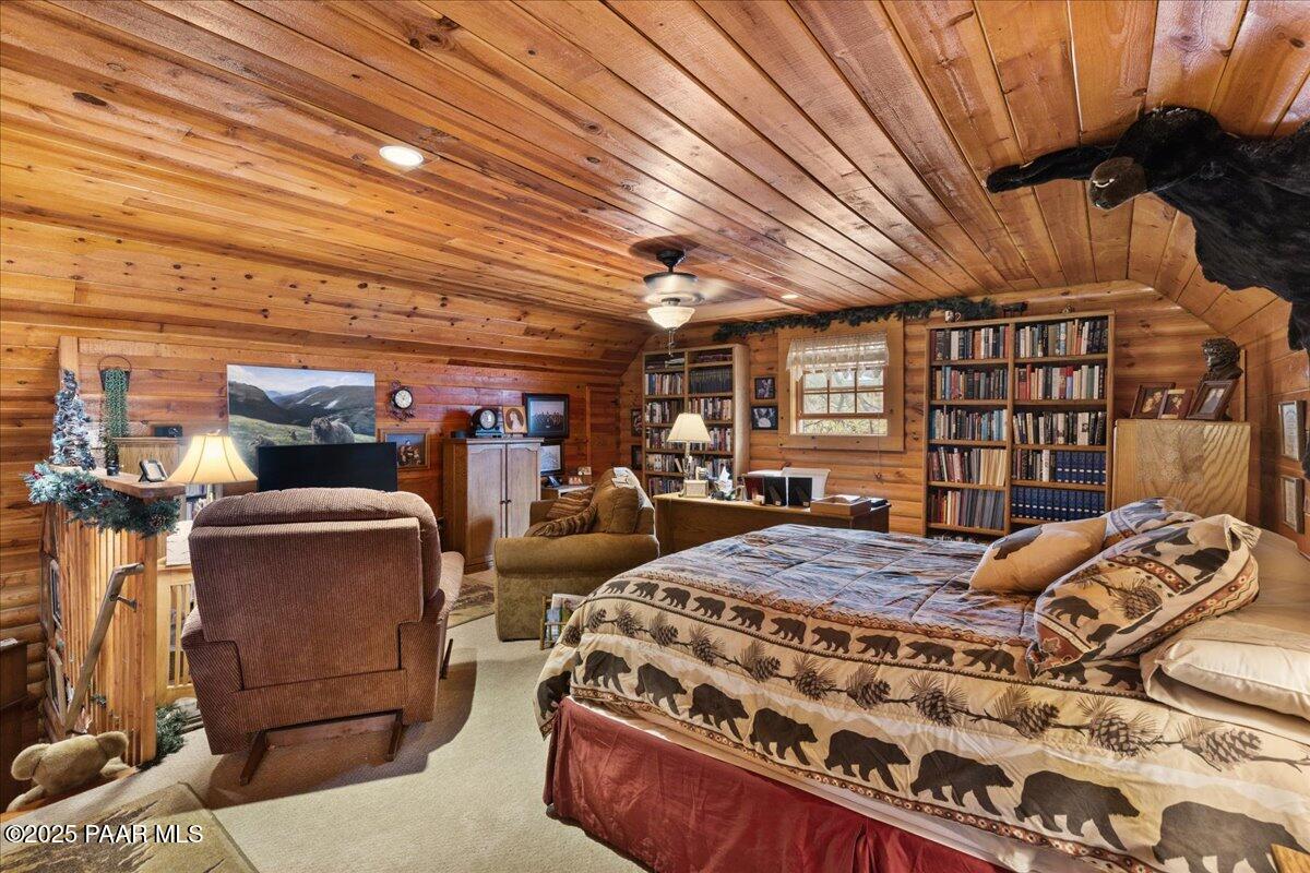1370 East Pine Ridge Drive Prescott, AZ 86303 - Photo 25 of 32 a bedroom with bed and wooden floor