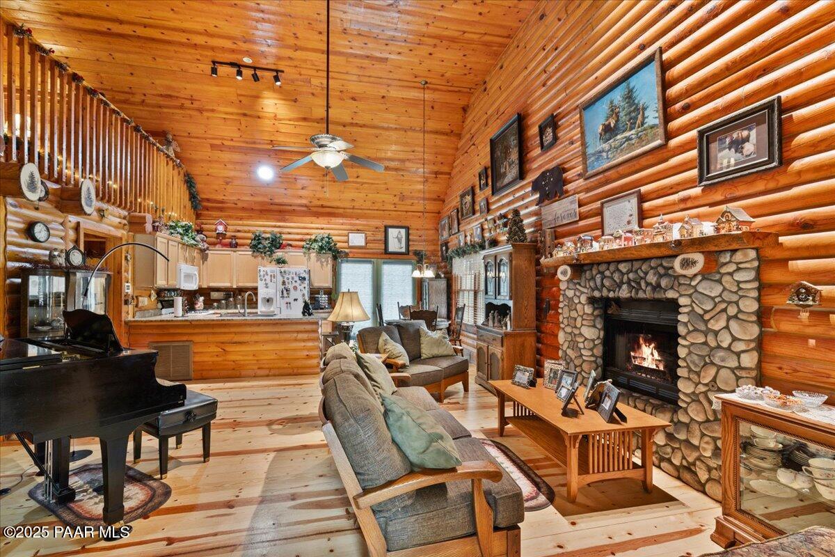 1370 East Pine Ridge Drive Prescott, AZ 86303 - Photo 8 of 32 a view of a patio with couches chairs and a fireplace