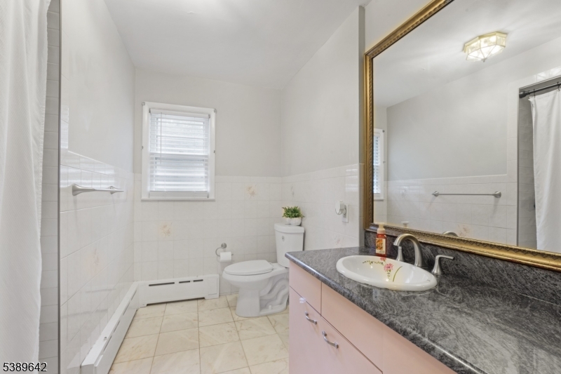 202 Mt Horeb Road Warren, NJ 07059 - Photo 11 of 23 a bathroom with a granite countertop sink and a mirror