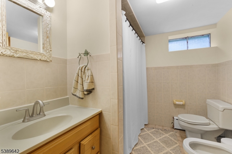 202 Mt Horeb Road Warren, NJ 07059 - Photo 18 of 23 a bathroom with a sink toilet and vanity