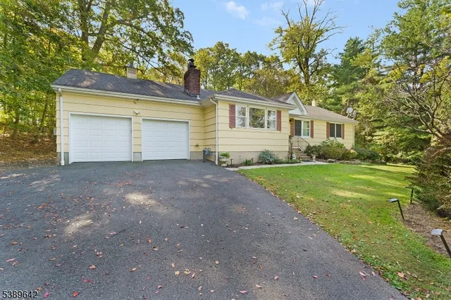 a front view of a house with yard
